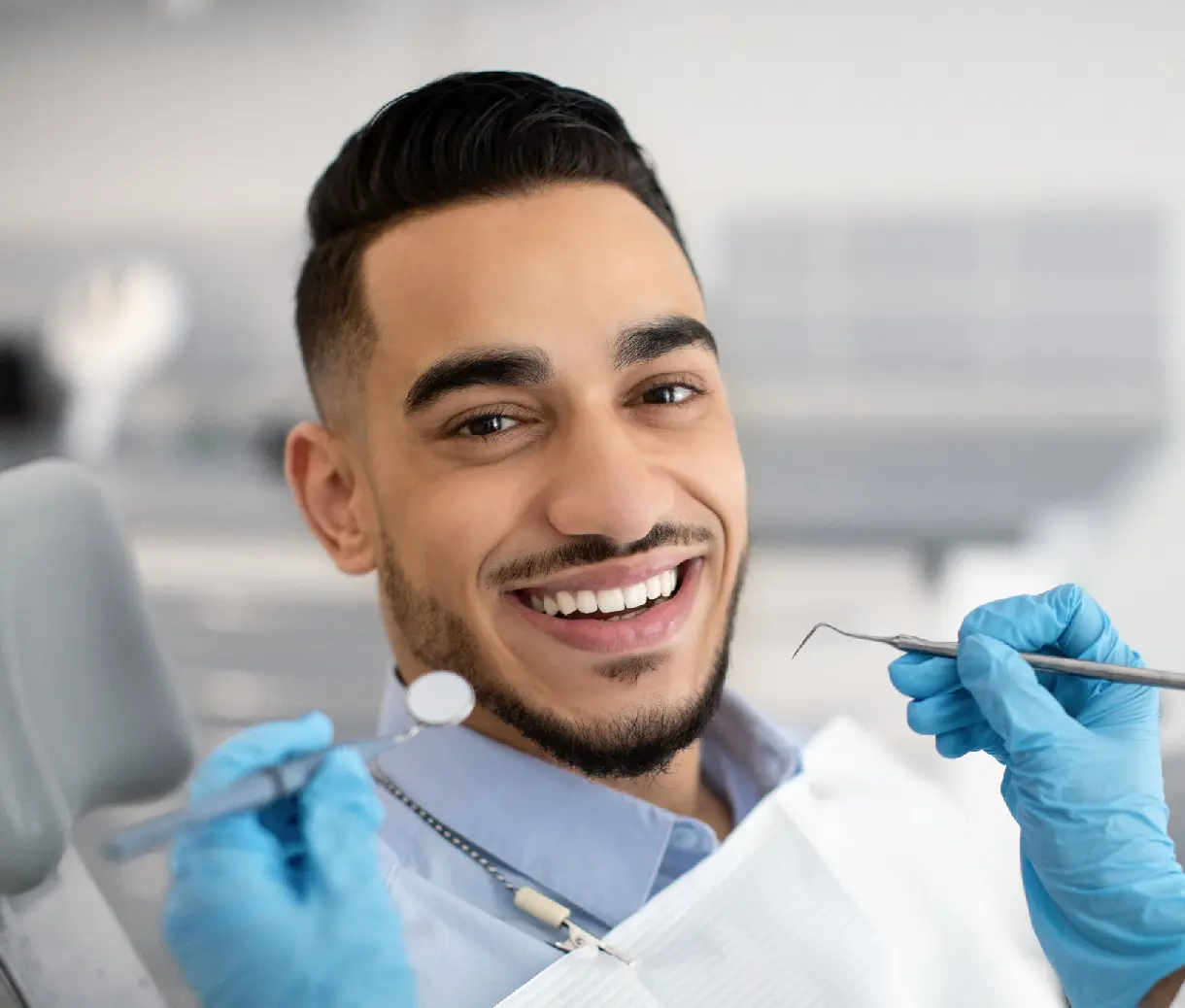 Smiling man at the dentist's office.