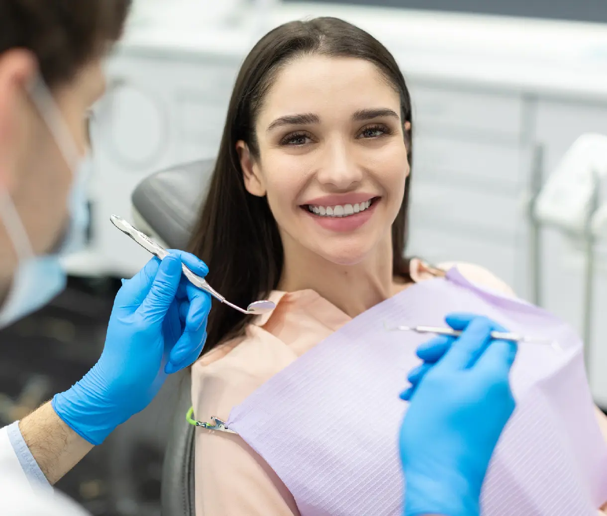 Woman smiling during dental check-up.